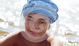 Portrait of a ten-year-old boy in a blue turban.