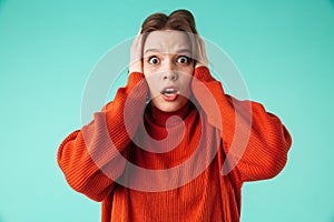 Portrait of a terrified young woman dressed in sweater