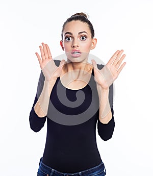 Portrait of terrified young woman staring at camera