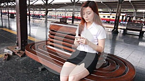 Portrait of thai adult student university beautiful girl calling smart phone