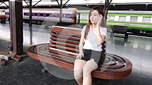 Portrait of thai adult student university beautiful girl calling smart phone