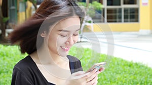 Portrait of thai adult student university beautiful girl calling smart phone