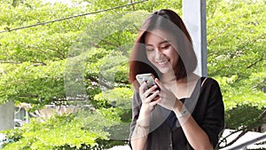 Portrait of thai adult student university beautiful girl calling smart phone