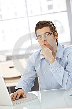 Portrait of thinking businessman