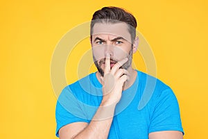 Portrait of thinking man with confused puzzled face on studio isolated background. Man thinking, pensive expression
