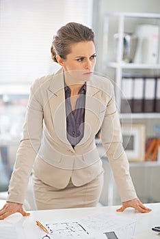 Portrait of thoughtful business woman in office