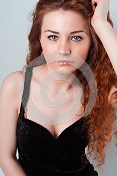 Portrait of thoughtful female touching her hairs
