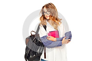 Portrait of a thoughtful girl wearing glasses looking aside over