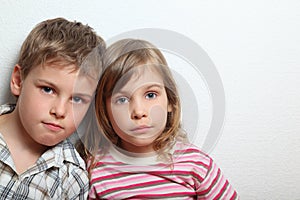 Portrait of thoughtful little girl and boy