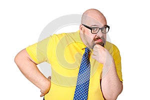 Portrait of thoughtful middle-aged man in a bright yellow dress.