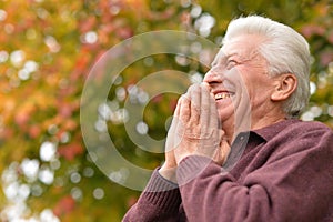 Portrait of a thoughtful senior man praying