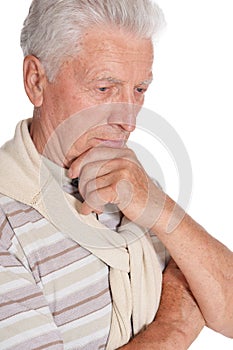 Portrait of thoughtful senior man on white background