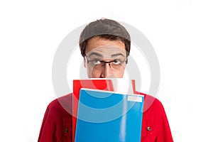 Portrait of thoughtful student with its books isolated on white