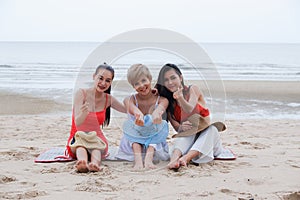 Portrait three asia women, girls group friends having fun together on the beach