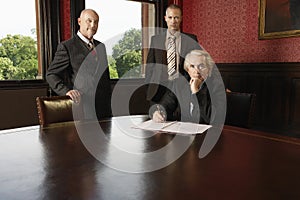 Portrait of Three businessmen in boardroom