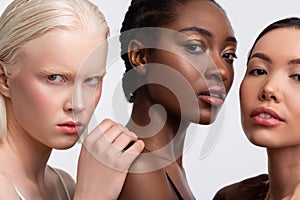 Portrait of three females with different complexion feeling confident