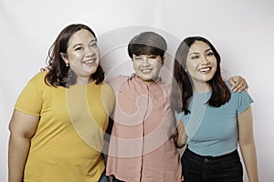 A portrait of three friends are smiling expressing happy feeling, isolated by white background