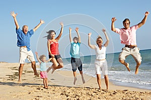 Portrait Of Three Generation Family On Beach