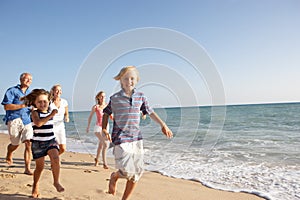 Portrait Of Three Generation Family On Beach