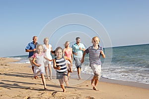 Portrait Of Three Generation Family On Beach