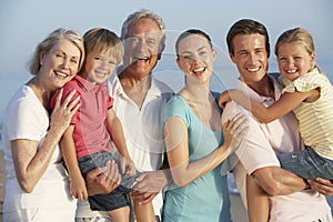 Portrait Of Three Generation Family On Beach Holiday