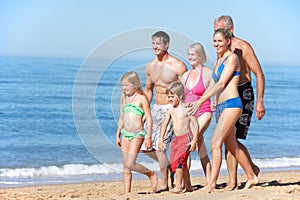 Portrait Of Three Generation Family On Beach Holiday