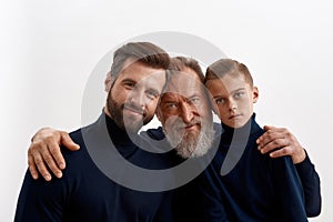 Portrait of three generations of men together