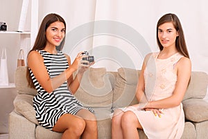 Portrait of three happy pretty young women at home