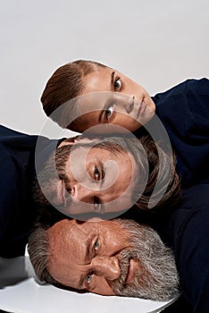 Portrait of three male generations heads faces