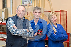 portrait three manual workers in row