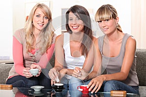 Three women at teatime