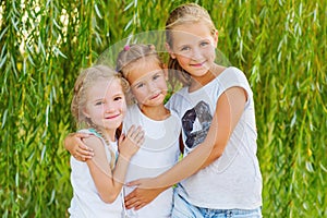 Portrait of three young cousins on willow