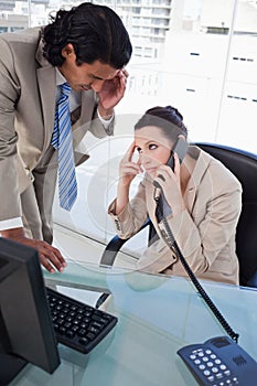 Portrait of a tired business team on the phone