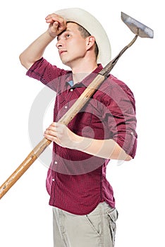 Portrait of a tired haggard farmer with a hoe on a white