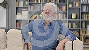 Portrait of Tired Senior Old Man having Back Pain