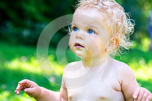 Portrait of a toddler baby girl with blue eyes