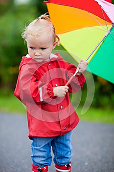 Portrait of toddler girl with umbrella