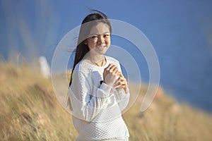 portrait toothy smiling face of asian girl relaxing emotion outdoor lifestyle