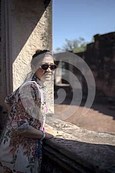 Portrait of toothy smiling face asian woman in prasat hin pimai