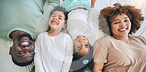 Portrait, top view and parents with children in bed enjoy morning for bonding, quality time and relaxing. Black family