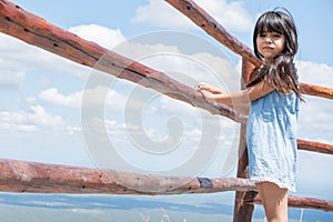Portrait of a tourist girl at a mountain viewpoint.