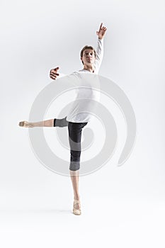 Portrait of Training Caucasian Young, Handsome Sporty Athletic Ballet Dancer with Lifted Hand Over White