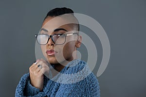 Portrait of transgender woman wearing eyeglasses