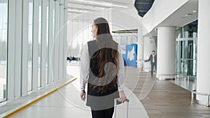 Portrait of a traveling business woman talking on cell phone at airport, happy student with suitcase run on flight happy