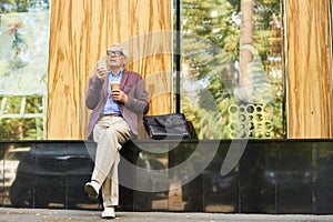 Trendy Senior Man Relaxing in Street