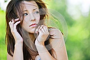 Portrait of troubled brunette girl