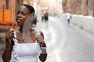 Portrait of turist woman dressed in white getting to know Europe, Ferrara. Italy