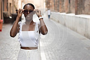 Portrait of turist woman dressed in white getting to know Europe, Ferrara. Italy