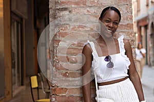 Portrait of turist woman dressed in white getting to know Europe, Ferrara. Italy