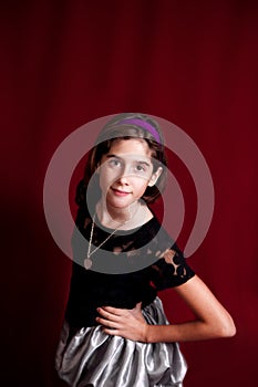 Portrait of a Tween on a Deep Red Backdrop